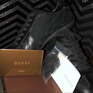 Black Gucci Sneakers wear not noticeable when worn. Original box and paperwork.